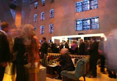 To highlight the six-story shell of the original building—the lower section of Foster’s tower is enclosed by the old structure—approximately 2,000 LED candles on acrylic shelves filled the eastern windows.