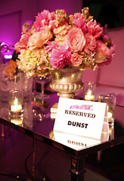 Ron Wendt Designs created dozens of French-style centerpieces for the seating area, each made up of pink roses, hydrangeas, tulips, lilies, hypericum berries, and lisianthus.