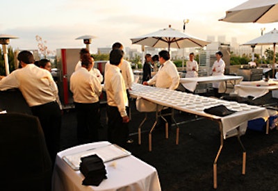 Thomas Keller, Charlie Trotter, Todd English, Cat Cora, Kristoffer Luczak, and Jean-Charles DuBois and their staffs worked in a rooftop kitchen at the Raffles L’Ermitage Starlight Dinner.