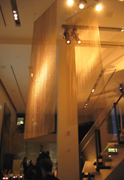 Robert Lee Morris’s design for the bottle inspired the gold bead installation that hung from the two-story ceiling.