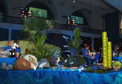 Suzanne Couture Modelmaking’s centerpiece inside the buffet station included real palm trees, orchids, spider plants, and banana trees.