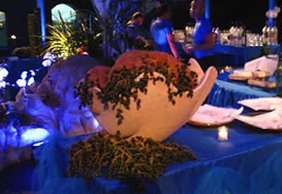 Delaney T. Bagwell worked with the caterer to incorporate the decor into the food presentation, filling oversize resin shells with bread.