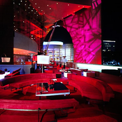 On the second night, a terrace featured groupings of furniture covered in plush, red ultrasuede, red tablecloths, red carpet, and red orchids and roses.