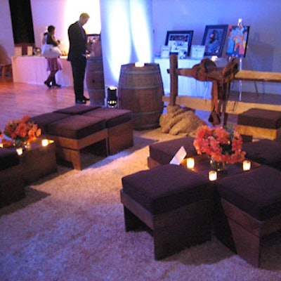 American Foliage & Design Group created a fenced-in lounge area with wooden posts and rails and decorative saddles.