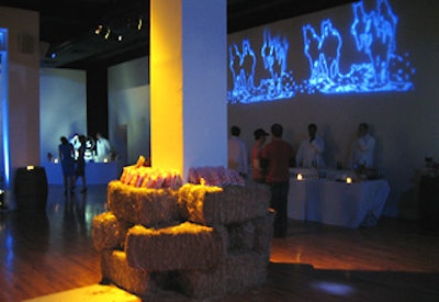 Topped with bags of caramel corn, bales of hay decorated the bases of columns, and blue projections of charging horses illuminated the walls.