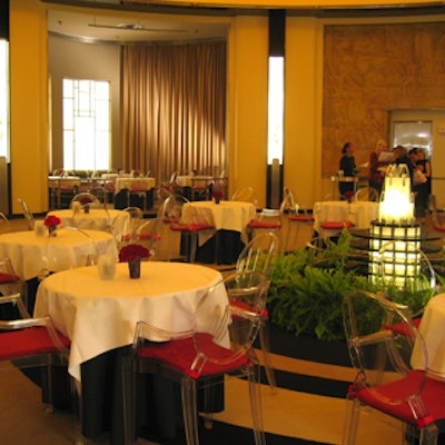 The Carlu's Round Room featured a casual atmosphere, with caf? tables covered in white linens ghost chair seating.