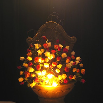 Uplit arrangements of roses created a dramatic effect.