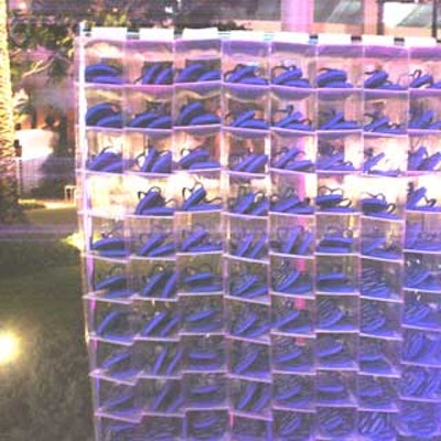 A shoe check-in spot let guests trade their shoes for blue CSC branded flip-flops.