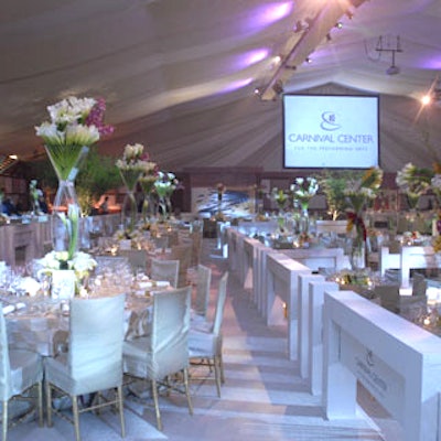 Barton G. created a lavish setting for the gala using light hues and towering centerpieces.