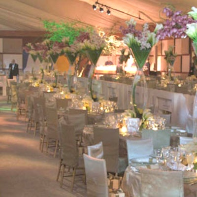 The monochromatic look of the tables paired with the towering centerpieces of colorful flowers created a dramatic look.