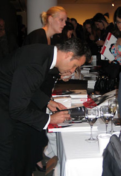 Houston signed copies of his latest book for the crowd. All royalties will be donated to HIV/AIDS charities.