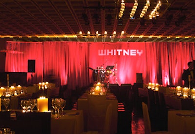 A red-lit stage awaited Sasha Lazard, who sang at both the dinner and the after-party.