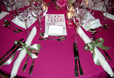 A simple green grass-colored bow tied the white napkins in place.