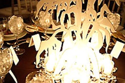The Gorey-inspired floral centerpieces consisted of intersected pieces of laser-cut Plexiglas, which offered four distinct views from different sides of the table.