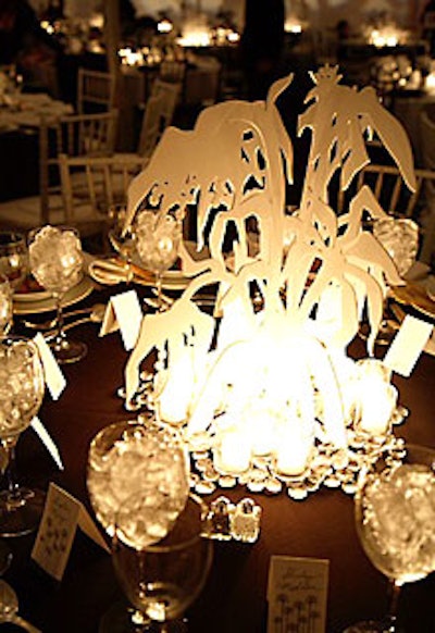 The Gorey-inspired floral centerpieces consisted of intersected pieces of laser-cut Plexiglas, which offered four distinct views from different sides of the table.