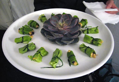 Sonnier & Castle passed hors d'oeuvres on black and white trays garnished with spiky-topped succulent plants during the cocktail hour, such as curried chicken with toasted coconut and currants wrapped with bibb lettuce bundles and tied with a chive.