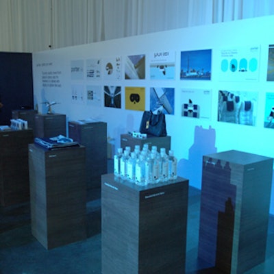 Square pedestal displays showcased in-flight amenities from Porter Airlines such as bottled water and sleep masks.