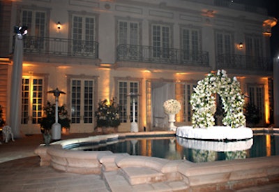 A working fountain—a fixture at the house—was dolled up with white flowers.