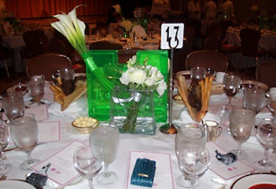 Plastic handbags served as vessels for floral centerpieces.