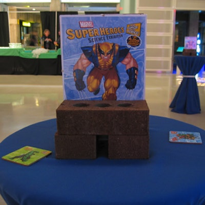 Bricks and superhero posters topped tables at the launch of the Marvel Super Heroes exhibit at the Ontario Science Centre.