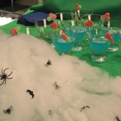 Fake spiders and spider webs decorated food tables from Gourmet Cuisine.