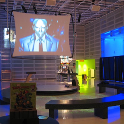 Large screens in the reception room showed exhibit elements such as images of the superheroes.