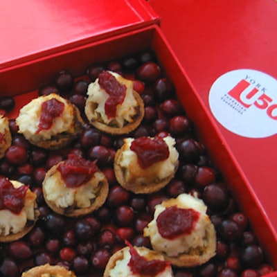 DLE passed mini turkey potpies in red boxes with beds of cranberries from Ginger Island Cuisine at York University's Power of 50 fund-raising campaign launch at the BMW Toronto showroom.