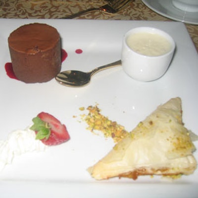 A trio of dessert included rich chocolate ganache; pistachio and honey baklava; and mihallabiya, a rose water milk pudding flown in from Egypt.