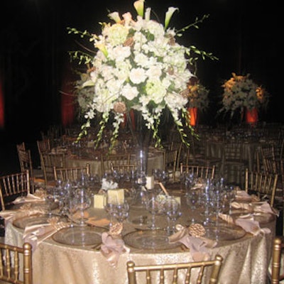 Daniel Events created massive centerpieces with all-white roses, hydrangeas, orchids, and lilies.