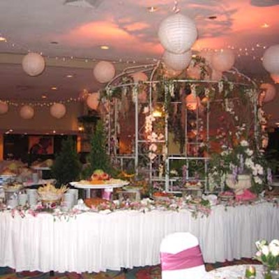 A Southern-style garden complete with gazebo, lanterns, and foliage in the reception area welcomed guests to Baptist Health Foundation's Magnolia Ball.