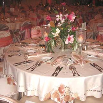 Over the Top Party Linens custom made taupe- and peach-colored embroidered linens for the tables.