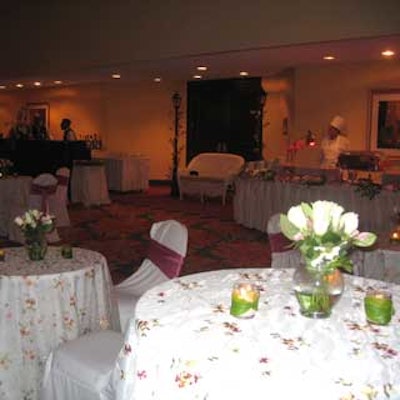 Cocktail tables were dressed with Over the Top's floral embroidered linens and simple white and pink floral centerpieces.