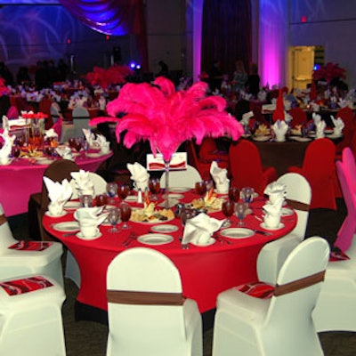 Tall martini glasses with hot pink feathers were just one of four different kinds of centerpieces that A La Carte Event Pavilion designed and coordinated for the event.