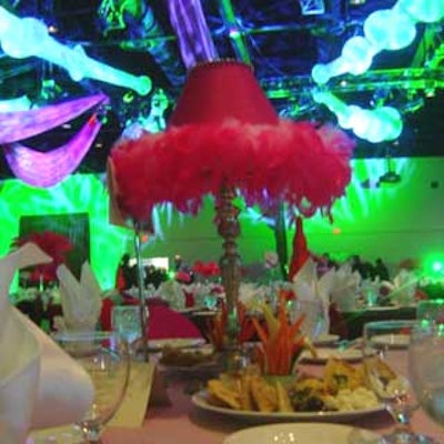 A feathered pink lamp added a whimsical touch to this table setting.