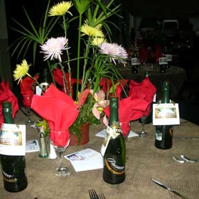 Tables were set with wine bottles that guests took away as gifts.
