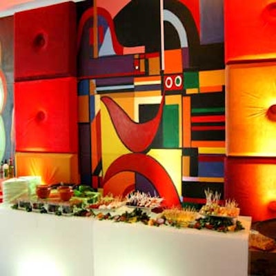 Brightly colored murals from Art of the Party served as a stunning backdrop to white lit bars that housed delicious catered cuisine.