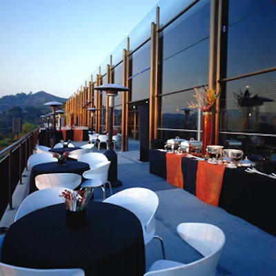 Guests gazed at the mountain views from their seats: white chairs clustered at small dark-clothed tables.
