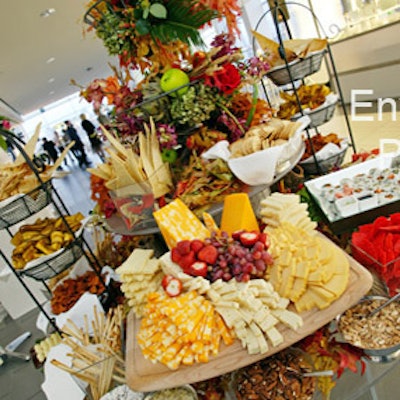 A harvest offering of tarot root chips, fresh baked breads, and cheeses from Encore Food with Elegance beckoned guests at the showroom entrance.>