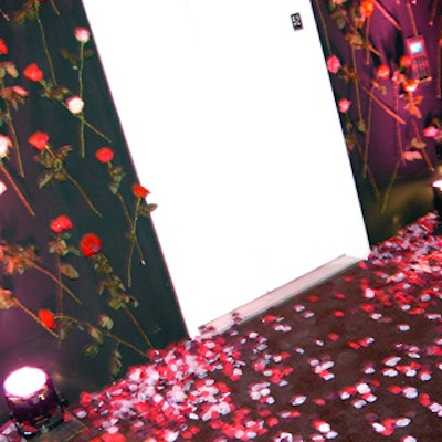 Guests entered the 52nd floor through a black-walled hallway covered in roses.