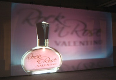 A screen next to the stage showed the fragrance’s bottle.