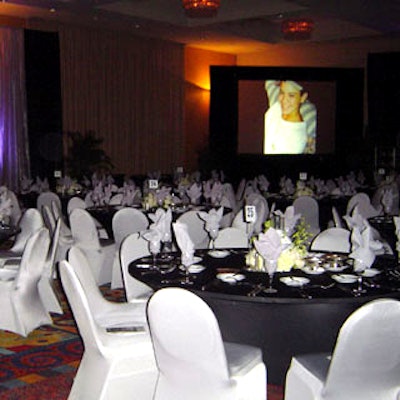 For the gala, conceptBAIT designed the ballroom at the Radisson Hotel Miami as an elegant spectacle of black and silver accented by white flowers.
