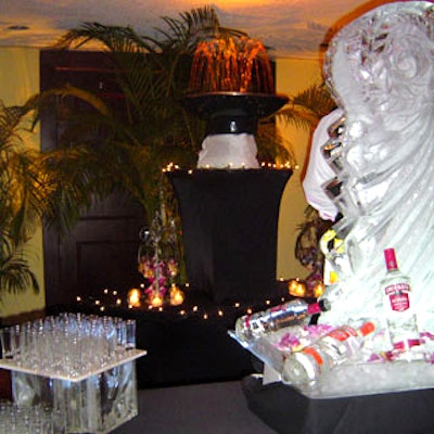 A fountain with sparkling strings of white lights and an ice sculpture decorated the caviar and vodka station.