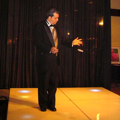 A magician entertained guests with his card tricks.