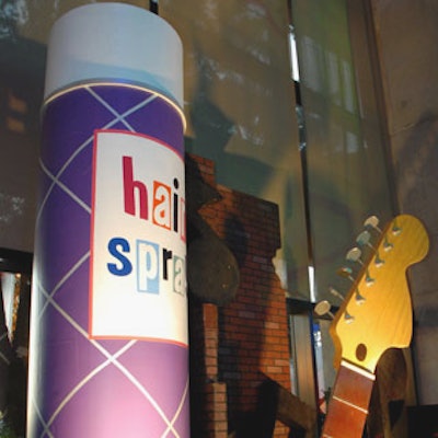 The stage was set with an oversize hairspray can and guitar neck.