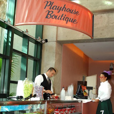 A concession stand provided multi-flavored popcorn and boxed candy.