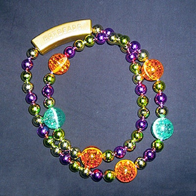 GeeWhizUSA.com distributes Hotbeads, Mardi Gras beads that light up with help from a battery pack.