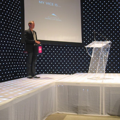 A LED-lit wall formed the backdrop for the white stage.