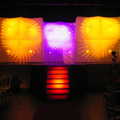 Three brightly coloured inflatable walls decorated the stage.