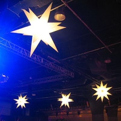 Inflatable star-shaped lights hung from the ceiling rafters.