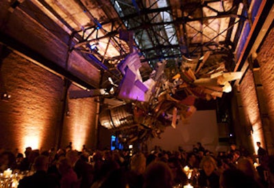 During dinner, a sound and light piece by Peter Coffin created changing illuminations on Nancy Rubins’ massive, cantilevered sculpture “MoMA and Airplane Parts.”